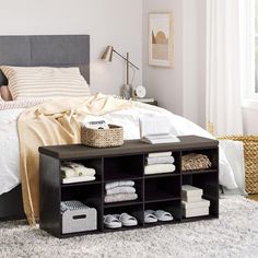 a bedroom with white walls and carpeted flooring