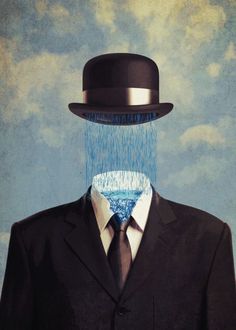 a man in a suit and tie with a hat on his head is raining water