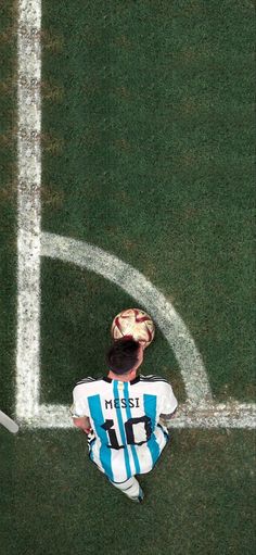 a man standing on top of a soccer field