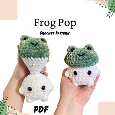 two small crocheted animals are held in their hands with the text frog pop above them