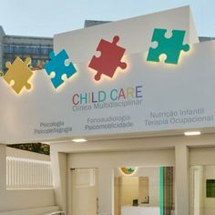 children's hospital sign with puzzle pieces hanging from the ceiling and on the wall