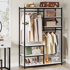 an organized closet with clothes, shoes and handbags on the shelves in front of a window