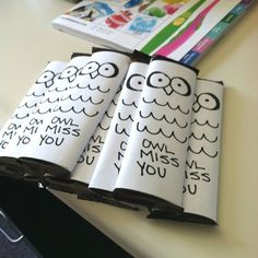 three books are sitting on top of a table next to a book with numbers and owls