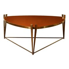 an orange table with two metal legs