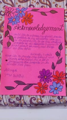 a pink piece of paper with flowers on it and the words acknoulodegement written in cursive writing