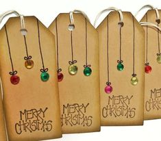 four tags with merry christmas written on them