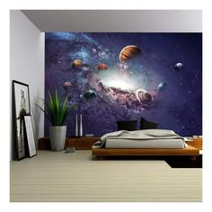 this is an image of a bedroom with planets on the wall and in the ceiling