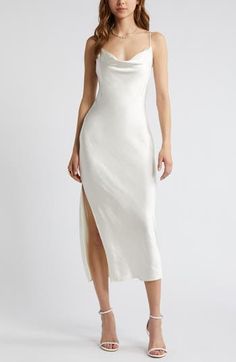 Effortless to style up or down, this gracefully draped satin slipdress belongs in your wear-on-repeat collection. 26 1/2" to 46" center front length (size Medium) Cowl neck Adjustable straps Unlined 100% polyester Machine wash, tumble dry Imported Cowl Neck Reception Dress, White Cowl Neck Dress, White Silk Slip Dress, White Satin Cocktail Slip Dress, White Satin Slip Dress, Ivory Silk Dress, Satin Cowl Back Slip Dress For Wedding, Silk White Dress, Graduation Dress White