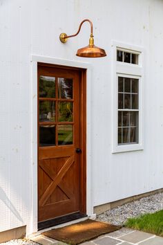 a white house with a wooden door and window