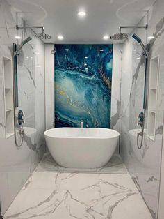 a white bath tub sitting inside of a bathroom next to a walk in shower stall