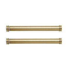 two brass colored handles on a white background