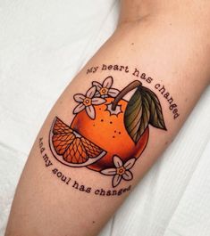 an orange tattoo on the left arm with words and flowers around it that says, my heart has changed if you had changed