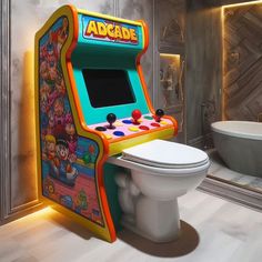 an arcade game sitting next to a toilet in a bathroom