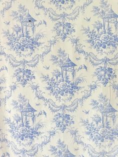 a blue and white wallpaper pattern with birds