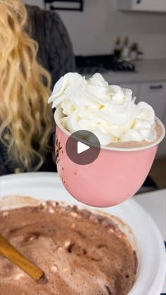 a bowl of ice cream next to a plate of chocolate cake with whipped cream on top