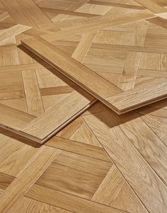 two pieces of wood laying on top of each other in the middle of a floor