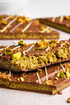 chocolate and pistachio barkle bars are arranged on a table