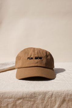 "Im not like a regular mom , I'm a fun mom." Intentionally Blank "Fun Mom" hat saying it all for you. cool mom One size. Adjustable back. Hand embroidered in LA. PIPE AND ROW Fun Mom, Mom Hat, Intentionally Blank, Black Writing, Mom Hats, Cool Mom, Best Mom, Hand Embroidered, Outfit Of The Day