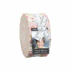 a roll of multicolored fabric with an image of a woman's face on it