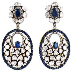 Inspired by the Mughal Era & Royal heritage these stunning earrings are handcrafted in 18-karat gold & sterling silver. They have a chandelier-style silhouette that's encrusted with 7.87 carats blue sapphire and 7.13 carats rose cut diamonds with blackened finish. FOLLOW MEGHNA JEWELS storefront to view the latest collection & exclusive pieces. Meghna Jewels is proudly rated as a Top Seller on 1stDibs with 5 star customer reviews. All items manufactured by us are handmade and can be customized o Mughal Jewelry Royals, Diamond Theme, Diamond Jewelry Earrings, Back Jewelry, Uncut Diamond, Birthday Jewelry Gift, Sapphire Earrings, Yellow Gold Earring, Stunning Earrings