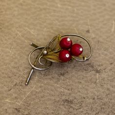 Vintage Red Floral Seeds Beads Abstract Brooch  GENERAL DESCRIPTION  Vintage Brooch Color: Gold Tone, Red Brand: NA Last photo includes measurements of the brooch. If you have any questions please feel free to message me! Red Vintage Lapel Pin As Gift, Vintage Red Lapel Pin As Gift, Red Vintage Lapel Pin For Gift, Vintage Red Lapel Pin For Gift, Elegant Red Brooch Pins, Vintage Red Pins For Gifts, Vintage Red Pins As Gift, Vintage Red Pins For Gift, Handmade Vintage Red Brooches