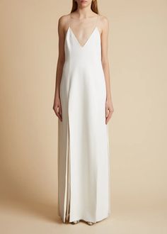 Exclusive to khaite.com. A fluid slipdress in robust bonded crepe satin. With delicate straps, deeply angled sides, and low back. Deep slits lined in chiffon. Slips on. #Khaite_nyc #Khaite #Dress #white #outfit #fashion @fannynaturaleza @khaite_nyc @modaoperandi @bloomingdales Low Back, Chiffon Dress, Holiday Party, Chalk, Mockup, Fashion Show, Slip Dress, Party Ideas, White Dress