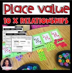 a poster with the words place value and two matching cards on it, along with other items