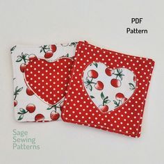 two red and white hearts are on top of each other, with polka dot fabric