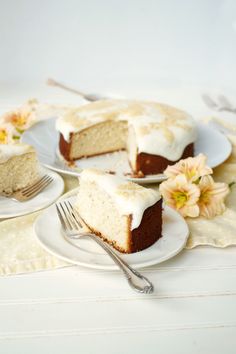 two plates with slices of cake on them and one slice has been cut from it