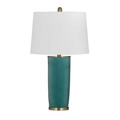 a green lamp with a white shade on it