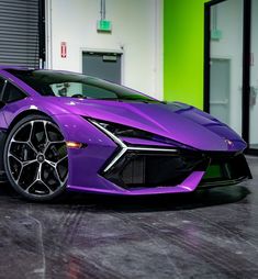 a purple sports car parked in a garage