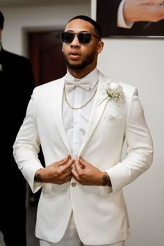 Looking for the perfect men's wedding suit? A white tuxedo might be your answer. Discover stylish and sophisticated white tuxedo ideas for grooms, ensuring you look sharp on your big day. Men's grooms getting ready photos on his wedding day Man White Suit Wedding, Groomsmen Suits White, All White Wedding Tuxedo For Groom, White Tux Men Wedding, White Wedding Groom Suit, All White Suit For Men Wedding, Wedding Groom Suit White, Groom In All White