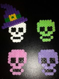 three legos made to look like skulls