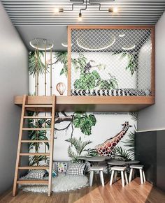 a loft bed with a ladder to the top and a giraffe mural on the wall