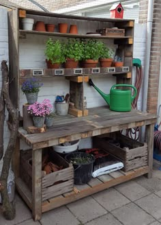 a potting bench with pots and plants on it