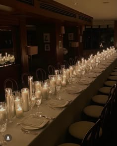 a long table with many candles on it