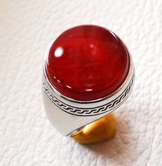 Aqeeq agate carnelian ring sterling silver 925 red natural round flat semi precious stone all sizes fast shipping middle eastern jewelry Risk free Quality guarantee policy : If you are not satisfied with your item for any reason simply send it to us and you will get a replacement or refund . please write or choose your size with the order and we will size it for you . Our ring is handcrafted mostly with a few simple tools . but some methods are used in casting like lost wax method . sterling sil Classic Agate Round Rings, Classic Agate Ring, Classic Round Agate Ring, Elegant Round Carnelian Signet Ring, Carnelian Signet Ring With Polished Finish, Round Agate Gemstone Signet Ring, Agate Gemstone Signet Ring, Red Cabochon Round Gemstones, Red Cabochon Gemstones