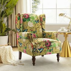 a living room filled with furniture and a potted plant