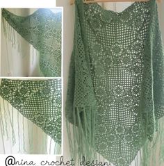 a crocheted shawl with fringes hanging on a wall next to a wooden hanger