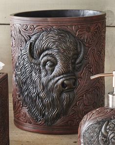 a bathroom set with a buffalo head on the side and soap dispenser