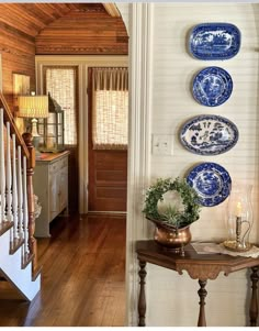 the instagram page for instagram com features blue and white plates hanging on the wall