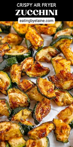 Air fryer zucchini pieces on parchment paper. Zucchini In Air Fryer Recipes, Zucchini Bites Air Fryer, Airfry Zucchini Recipes, Airfryer Zucchini Recipes, Air Fryer Vegetables Easy Recipes, Air Fryer Fried Zucchini, Air Fry Zucchini, Zucchini Recipes Air Fryer, Zucchini In The Air Fryer