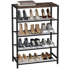 four tier shoe rack with six pairs of shoes on top and two rows of shoes below