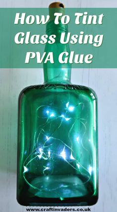 a green glass bottle with some lights in it and the words how to tint glass using pva glue