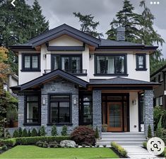 a large house with black trim and windows