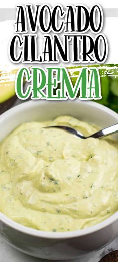 avocado cilantro cream in a white bowl with a spoon next to it