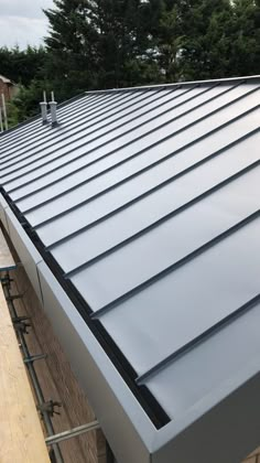 a metal roof is being installed on a house