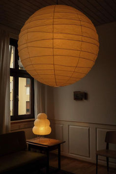 a lamp hanging from the ceiling in a living room