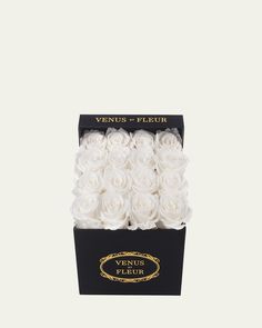 a black box with white roses in it