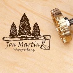 a woodworking stamp that says jon martin woodworking on the front and back of it